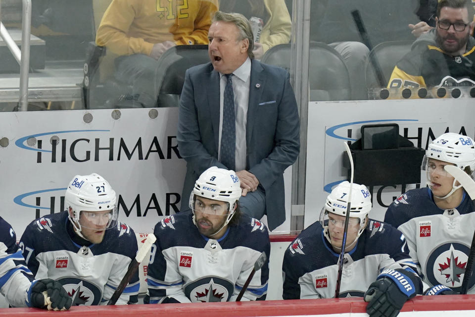 Winnipeg Jets head coach Rick Bowness stands behind the bench during the first period of an NHL hockey game against the Pittsburgh Penguins, Tuesday, Feb. 6, 2024, in Pittsburgh. (AP Photo/Matt Freed)