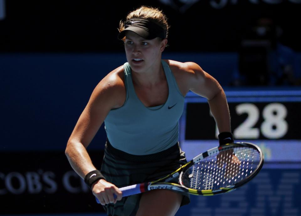 Eugenie Bouchard of Canada chases a return to Ana Ivanovic of Serbia during their women's quarter-final tennis match at the Australian Open 2014 tennis tournament in Melbourne January 21, 2014. REUTERS/Petar Kujundzic (AUSTRALIA - Tags: SPORT TENNIS)