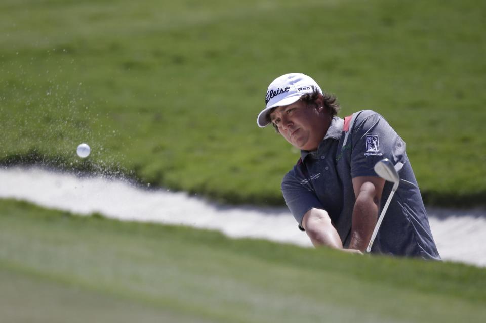 Jason Dufner hits from a sand trap on the second hole during the third round of the Cadillac Championship golf tournament Saturday, March 8, 2014, in Doral, Fla. (AP Photo/Wilfredo Lee)