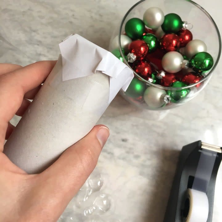 THE IDEA: According to the blog Dandelions and Dust Bunnies, the toilet paper roll will take up space in the middle of your vase that you'd otherwise have to use filler to, um, fill.