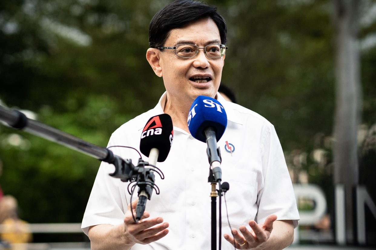 SINGAPORE - JULY 01: Candidate of Prime Ministry of Singapore Heng Swee Keat answers the questions of press members after meeting residents seeking support as the state goes to the polls for general elections in Singapore on July 01, 2020. Officials wore face masks during the campaign as maintaining social distance as a precaution against coronavirus (Covid-19) pandemic. (Photo by Zakaria Zainal/Anadolu Agency via Getty Images)