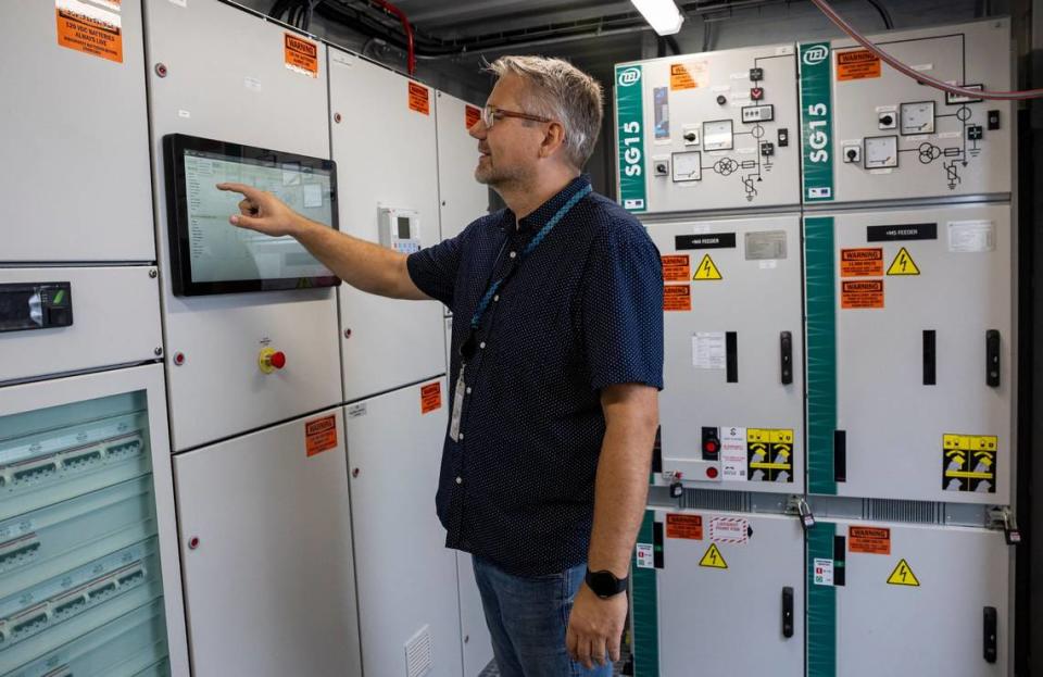 PowerCon Lead Software Engineer Mads Christiansen gives a tour of a shore power substation at the Carnival terminal before the start of a ribbon cutting event at PortMiami on Monday, June 17, 2024, in Miami, Fla. The event officially launched shore power at PortMiami, allowing cruise ships to turn off their engines and plug into a land side electrical power while docked, resulting in reduced emissions and noise.