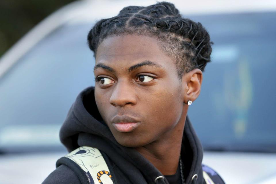 <p>Michael Wyke/AP Photo</p> Darryl George, a 17-year-old junior, before walking across the street to go into Barbers Hill High School after serving a 5-day in-school suspension for not cutting his hair Sept. 18, 2023, in Mont Belvieu, Texas.