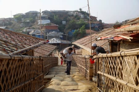 A Rohingya refugee boy walks in the Balukhali camp in Cox's Bazar