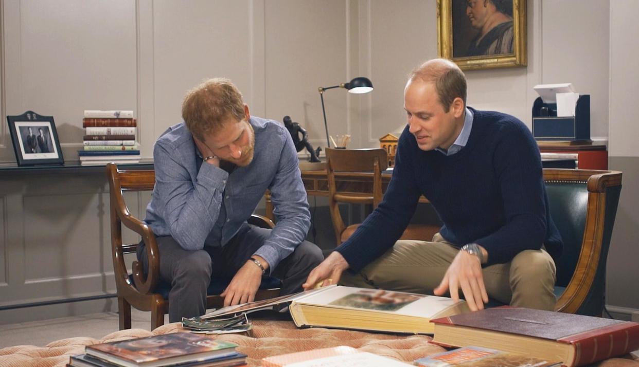 Poignant tribute: Princes William and Harry look through their mother's photo albums