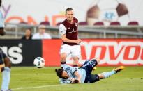 May 11, 2016; Commerce City, CO, USA; Colorado Rapids midfielder Sam Cronin (6) attempts to shoot the ball as Sporting Kansas City defender Nuno Coelho (12) defends in the first half at Dicks Sporting Goods Park. Mandatory Credit: Ron Chenoy-USA TODAY Sports