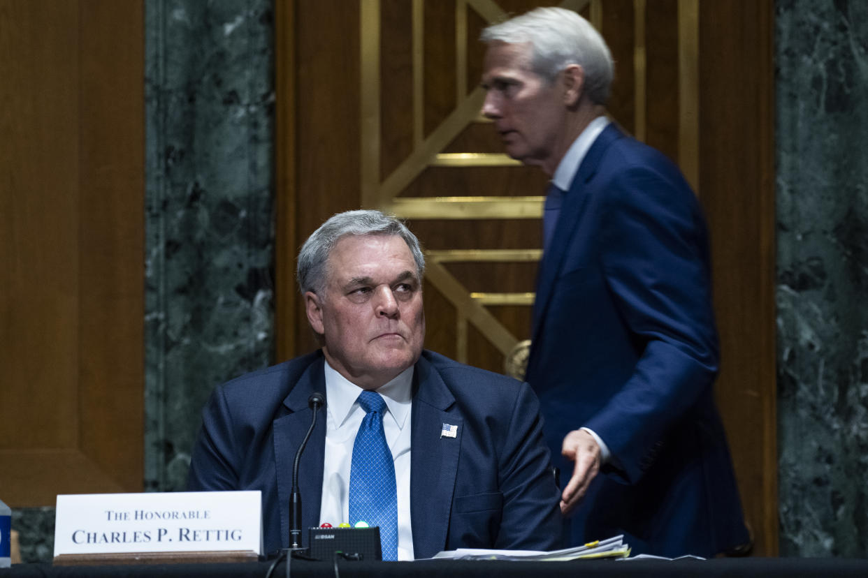 WASHINGTON, DC - JUNE 08: Sen. Rob Portman (R-OH) greets Charles P. Rettig, commissioner of the Internal Revenue Service during a Senate Finance Committee hearing June 8, 2021 on Capitol Hill in Washington, D.C. The committee is hearing testimony on the IRS budget request for 2022. (Photo by Tom Williams-Pool/Getty Images)