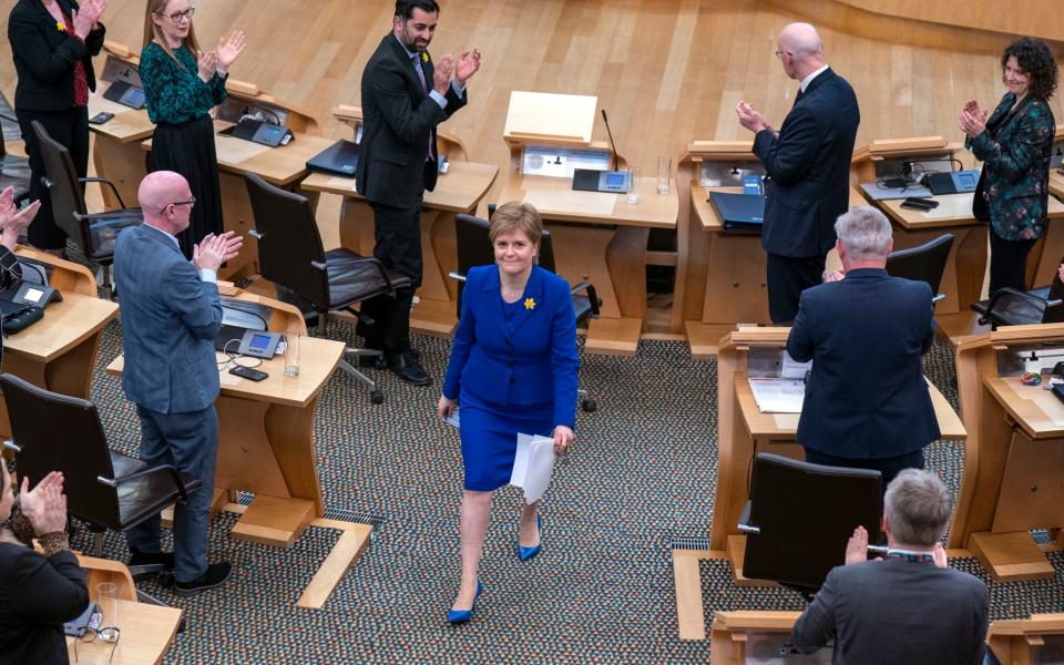Outgoing First Minister Nicola Sturgeon leaves the main chamber at Holyrood after her last First Minster's Questions - Jane Barlow/PA