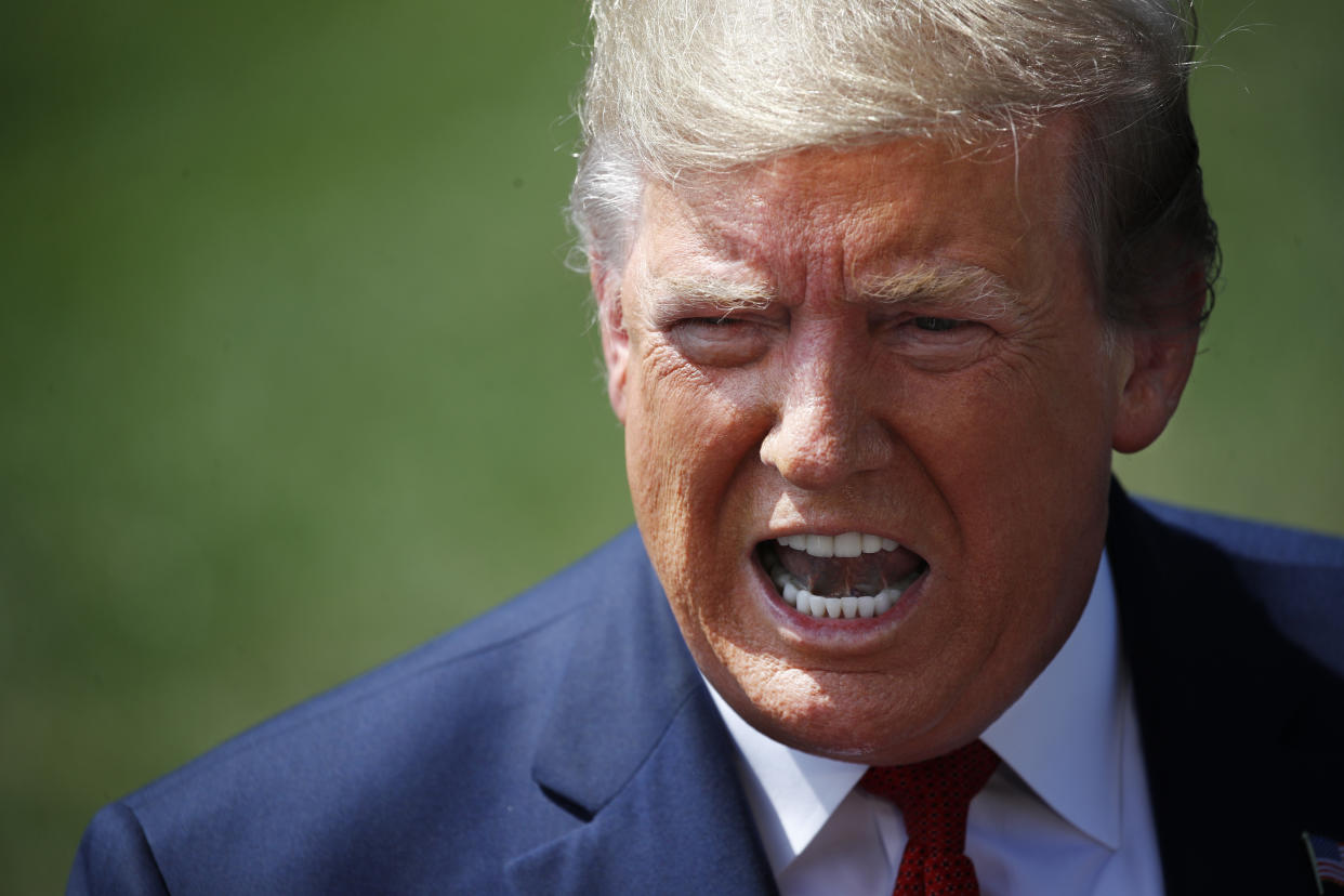 President Trump speaks with reporters on the South Lawn of the White House in Washington, D.C., on Wednesday. (AP Photo/Patrick Semansky)