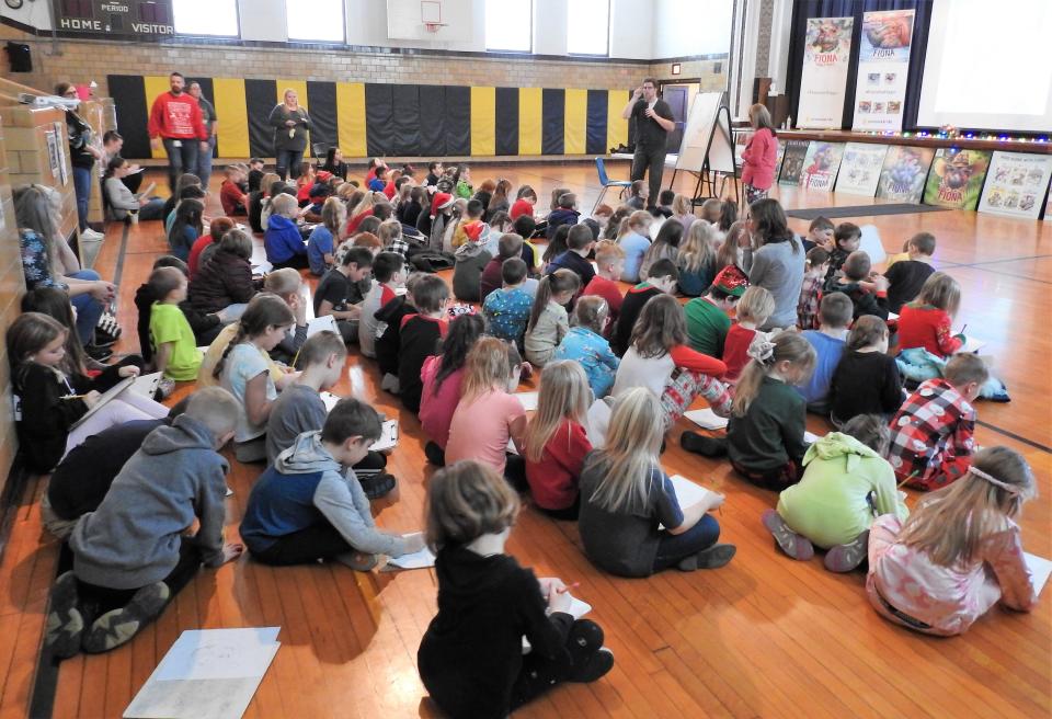 Part of Christmas week events at Conesville Elementary School this past week was a visit from children's book illustrator and author Richard Cowdrey of Mount Vernon. He had a slideshow on his life and artwork and taught students how to draw his signature character, Fiona the hippo.