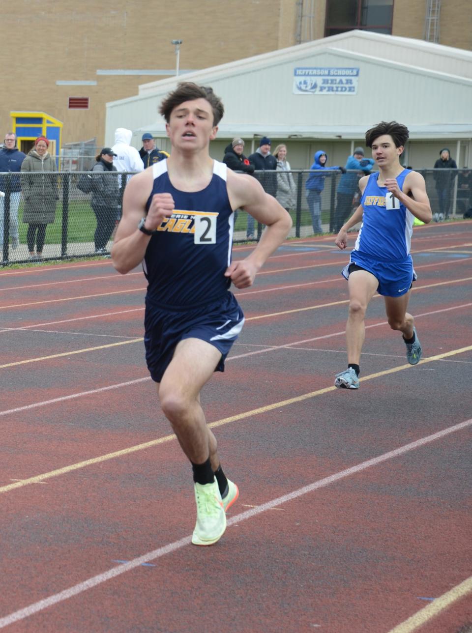 Erie Mason’s Jackson Ansel pulls away from Carter McCalister of Jefferson and down the stretch in the boys 1,600-meters at the Jefferson Invitational Saturday. Ansel won the race.