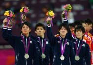 LONDON, ENGLAND - JULY 30: Silver medalists Kohei Uchimura, Yusuke Tanaka, Koji Yamamuro, Kazuhito Tanaka and Ryohei Kato of Japan celebrate during the medal ceremony in the Artistic Gymnastics Men's Team final on Day 3 of the London 2012 Olympic Games at North Greenwich Arena on July 30, 2012 in London, England. (Photo by Michael Steele/Getty Images)