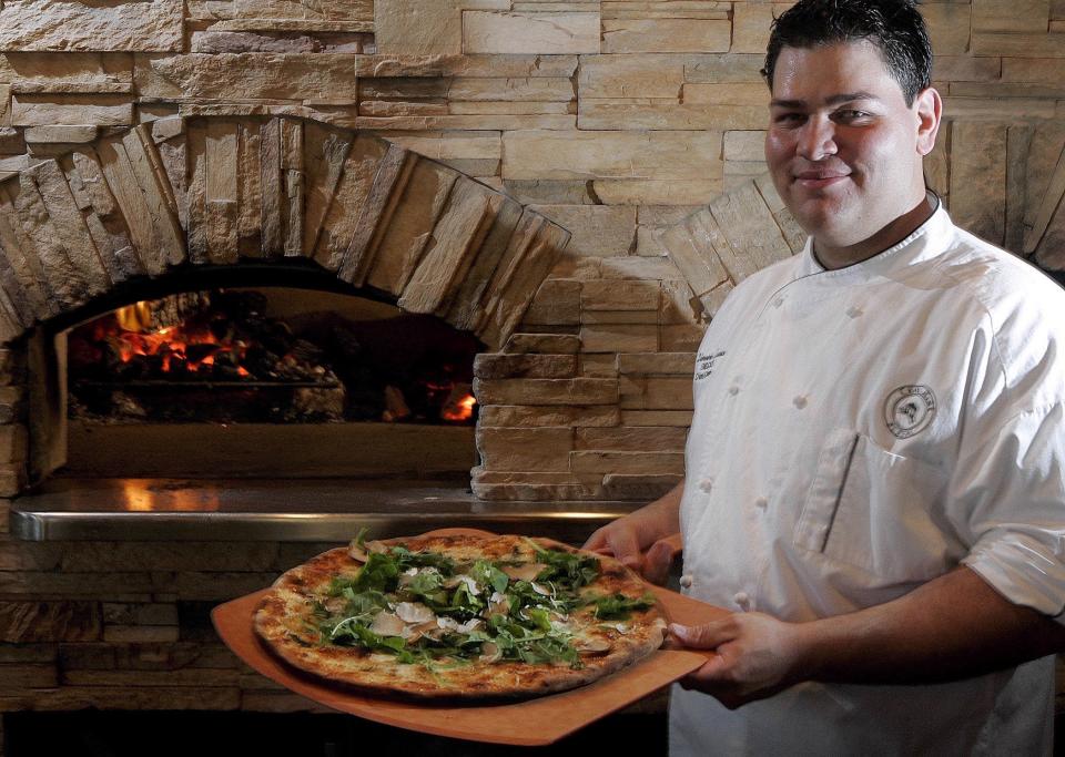 Flashback to May 2006: Coal Mine Pizza chef/co-owner Demetrio Zavala displays one of his truffled pizza specialty pies.At the time, the large-size pie (pictured) cost $150 and the small pie $75. Taking inspiration from French cuisine, Zavala added black truffle, rich cream and cheese to the pizza.