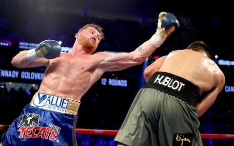 Canelo Alvarez throws a punch at Gennady GolovkinGetty