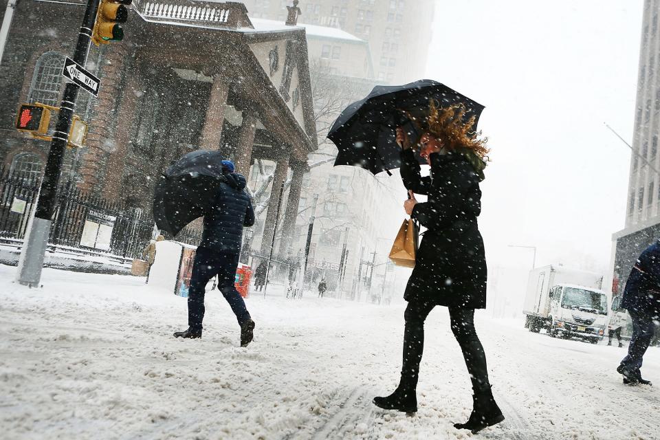 NEW YORK, NY - FEBRUARY 09: Pedestrians walk in the snow and wind in Manhattan on February 9, 2017 in New York City. A major winter storm warning is forecast from Pennsylvania to Maine with the New York City area expected to receive up to one foot of snow. New York City schools are closed for the day. (Photo by Spencer Platt/Getty Images)