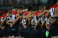 The Melbourne Demons pay thier respects.