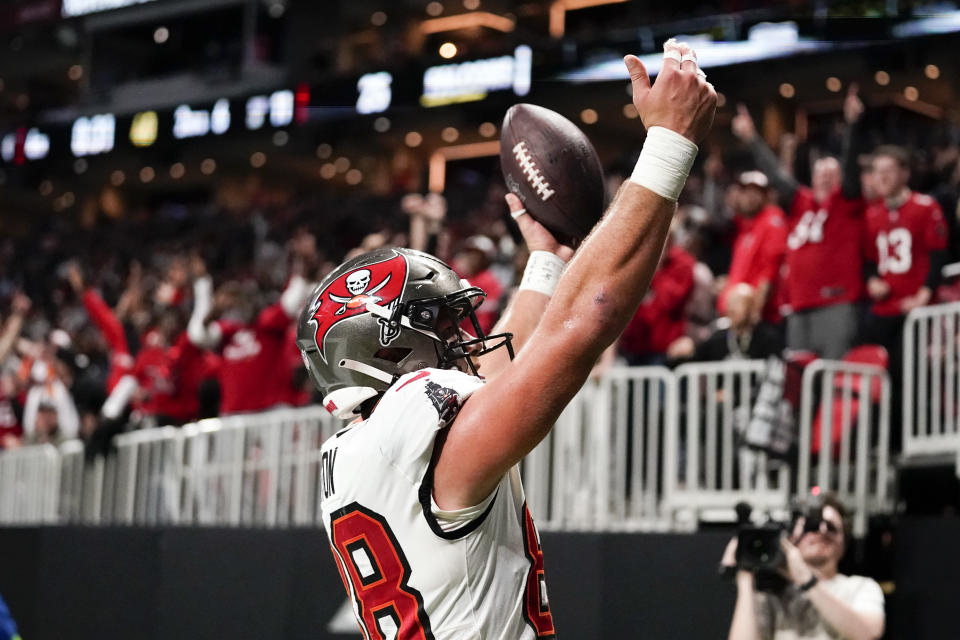 Tampa Bay Buccaneers tight end Cade Otton (88) reatcs after catching a touchdown pass against the Atlanta Falcons during the secondhalf of an NFL football game, Sunday, Dec. 10, 2023, in Atlanta. (AP Photo/Brynn Anderson)