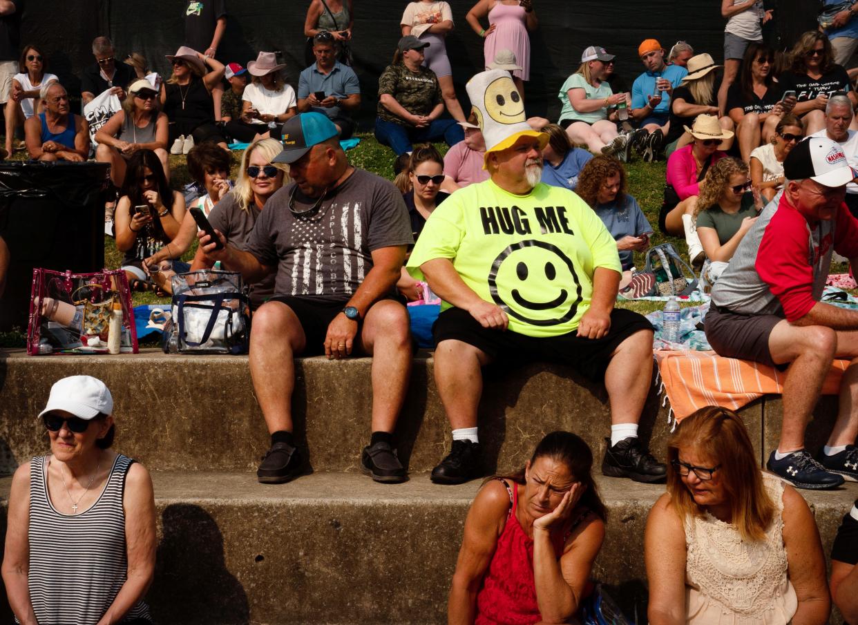 Richard Brewer of Loretto, Tenn., sports a "Hug Me" shirt and smiley face hat as he waits for Lainey Wilson to kick-off the action on the Riverfront Stage the first day of CMA Fest in Nashville, Tenn., Thursday morning, June 8, 2023. "I've got a big collection of big hats and this is my number one," Brewer said. "It brings a smile to people's faces."