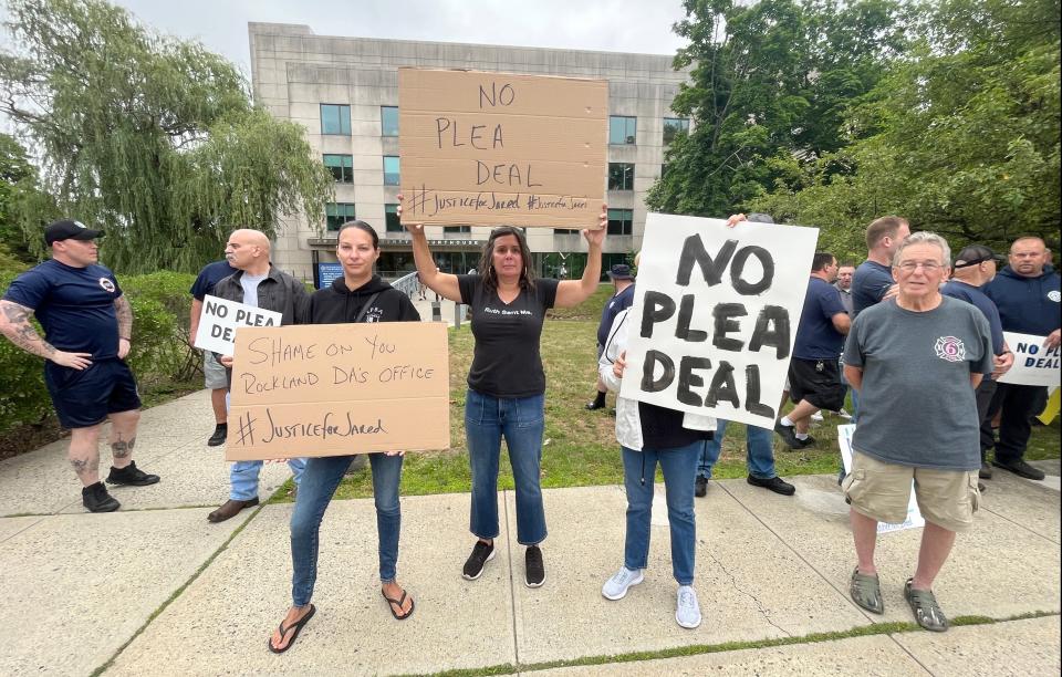 Firefighters and allies protest in front of the Rockland County Courthouse in New City on June 20, 2023, after Rabbis Nathaniel and Aaron  Sommer appeared in court to accept a plea deal in the fatal Evergreen Court fire case.