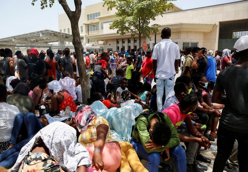 Haitians gather outside the U.S. Embassy after the assassination of President Jovenel Moise, in Port-au-Prince