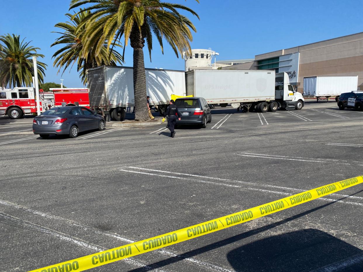 The Ventura Police Department investigates a fatality in the parking lot at Pacific View mall, where the driver of a parked big rig was apparently crushed between the rig's two trailers Friday morning.
