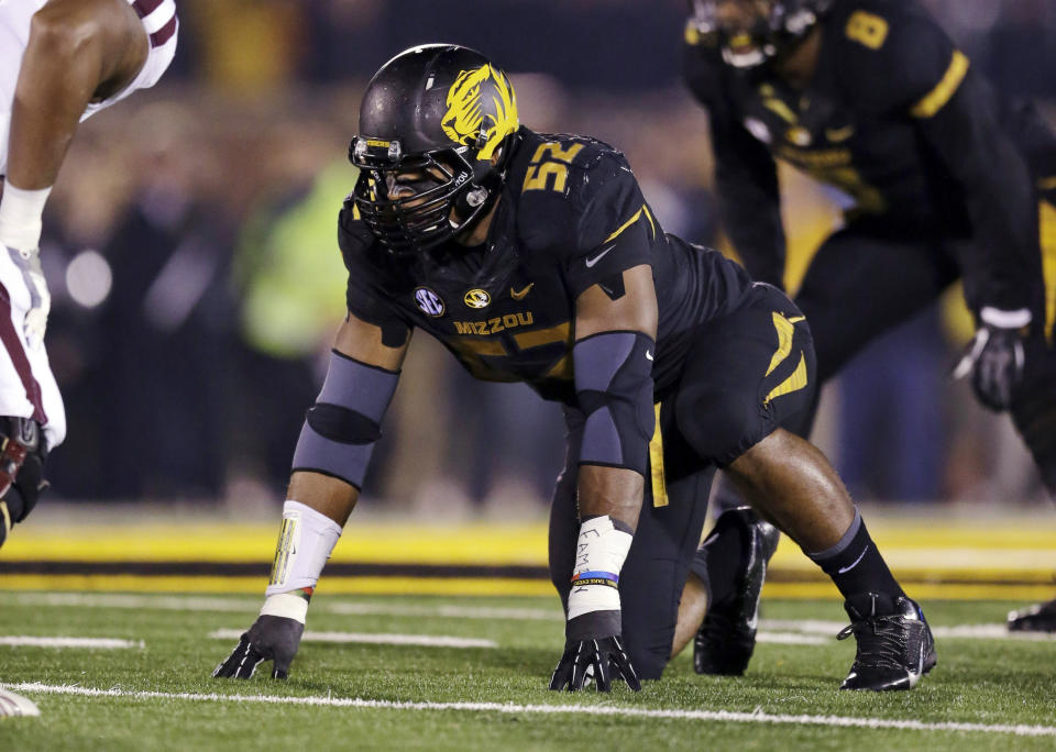 FILE - In this Nov. 20, 2013, file photo, Missouri defensive lineman Michael Sam takes up his position during the first half of an NCAA college football game against Texas A&M in Columbia, Mo. Sam was selected in the seventh round, 249th overall, by the St. Louis Rams in the NFL draft Saturday, May 10, 2014. The Southeastern Conference defensive player of the year last season for Missouri came out as gay in media interviews this year. (AP Photo/Jeff Roberson, File)