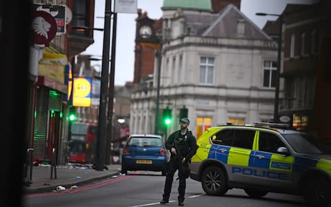 Armed police at the scene in Streatham High Road - Credit: &nbsp;Victoria Jones/PA