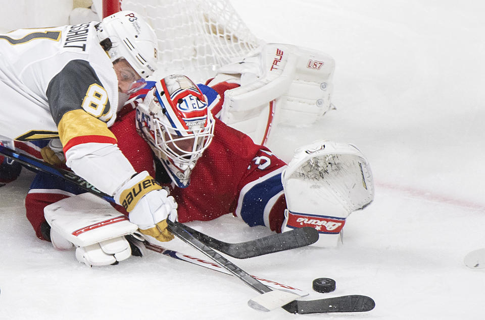 Montreal Canadiens goaltender Jake Allen stops Vegas Golden Knights' Jonathan Marchessault during the third period of an NHL hockey game Saturday, Nov. 5, 2022, in Montreal. (Graham Hughes/The Canadian Press via AP)