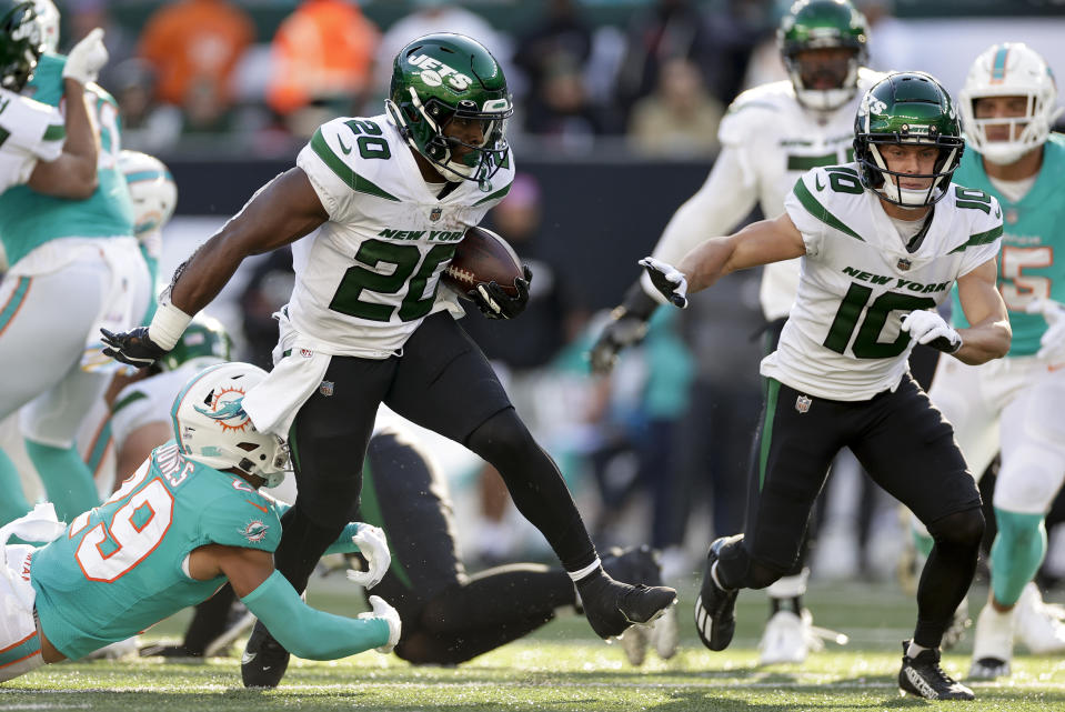 New York Jets running back Breece Hall (20) carries the ball against the Miami Dolphins during the fourth quarter of an NFL football game, Sunday, Oct. 9, 2022, in East Rutherford, N.J. (AP Photo/Adam Hunger)