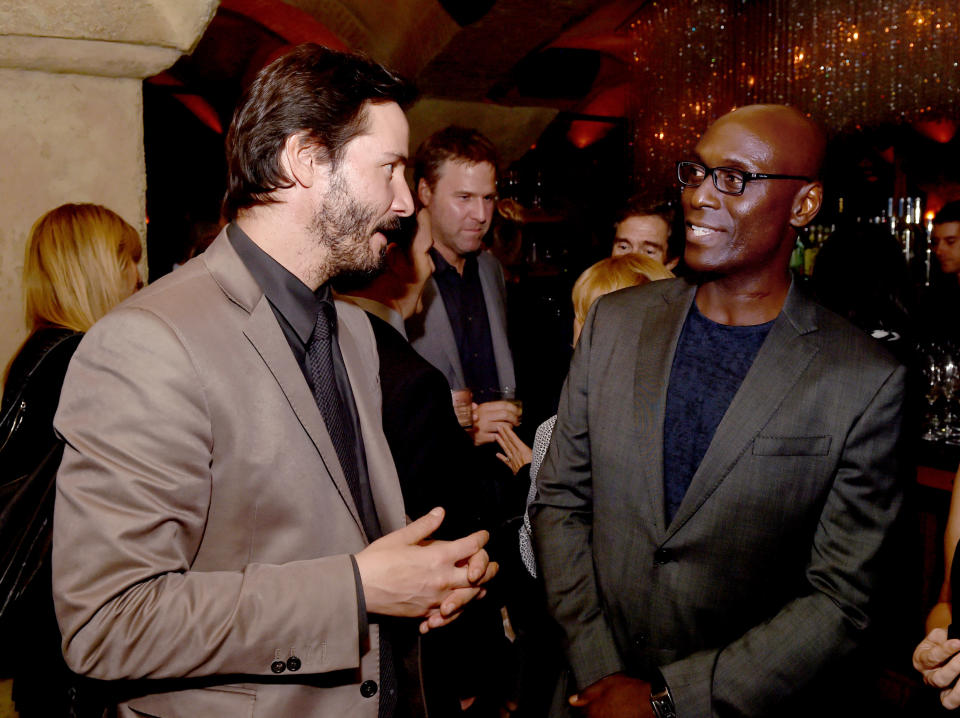 LOS ANGELES, CA - OCTOBER 22:  Actors Keanu Reeves (L) and Lance Reddick talk at the after party for the screening of Lionsgate Films' 