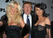 <p>Donald Trump is flanked by Victoria Silvstedt, 1997 Playmate of the Year, and his girlfriend, Melania Knauss, at <em>Playboy</em> magazine’s 50th anniversary celebration in New York City on Dec. 4, 2003. (Photo: Richard Corkery/NY Daily News Archive via Getty Images) </p>