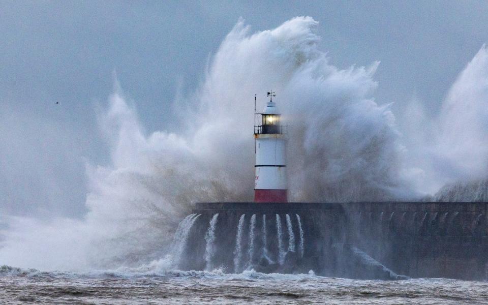 Waves batter Newhaven Harbour in East Sussex this morning