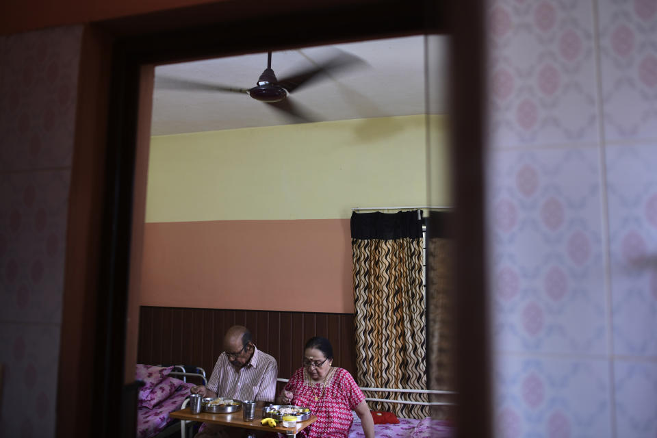 V.Baby, 84, retired math professor and his wife Vasanthi, 82 years, share a room at the Signature Aged Care in Kochi, Kerala state, India, March 6, 2023. The couple tried living in their home for a few years but with age-related health conditions catching up and unable to maintain the enormous home, they took a call to move to the assisted living center which is just a few kilometers from their home. Here, Baby is happy with the care he and his wife receive. "There is a feeling of safety we can only get here. We cannot get this at home," he said. (AP Photo/ R S Iyer)