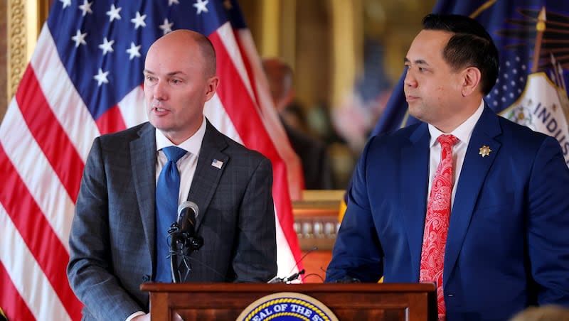 Gov. Spencer Cox is joined at the podium by Attorney General Sean Reyes as they take questions about plans to address the harmful impacts social media is having on the mental health and well-being of Utah youth in the Gold Room at the Capitol on Monday, Jan. 23, 2023.