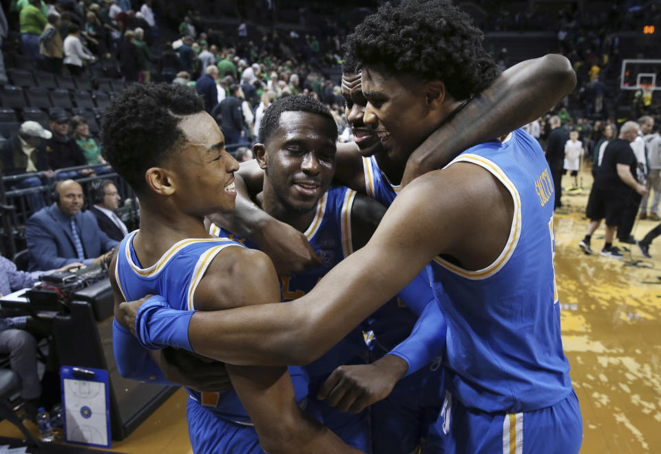 UCLA’s Jaylen Hands, left, Prince Ali, Kris Wilkes and Chris Smith celebrate after an improbable UCLA comeback. (AP)