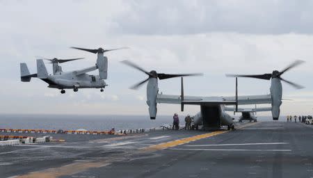 FILE PHOTO: U.S. Marine MV-22B Osprey aircraft land on the deck of the USS Bonhomme Richard amphibious assault ship during events marking the start of Talisman Saber 2017, a biennial joint military exercise between the United States and Australia, off the coast of Sydney, Australia, June 29, 2017. REUTERS/Jason Reed/File Photo