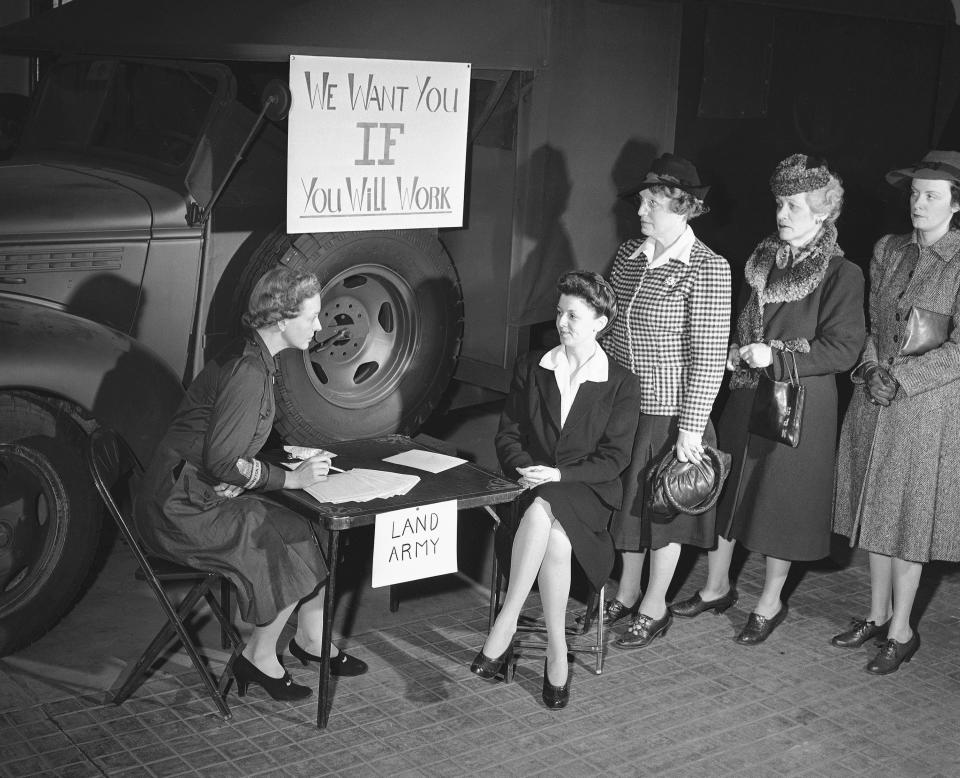FILE - In this Jan. 23, 1941, file photo, a group of Washington women sign up, at the headquarters of the newly organized American Women's Voluntary Service Agriculture Auxiliary in Washington, to take a course in farming to help ease shortage of farm labor caused by the war. The enlisted women will start off with a course in simple gardening and progress to dairy work and poultry tending and the care of farm machinery. Left to right: Mrs. Rodman Wanamaker, Mrs. Harold J. Pearson, Mrs. M. L. Sweet, Mrs. Williams C. Knight, and Mrs. Robert Harvey. (AP Photo/William J. Smith, File)