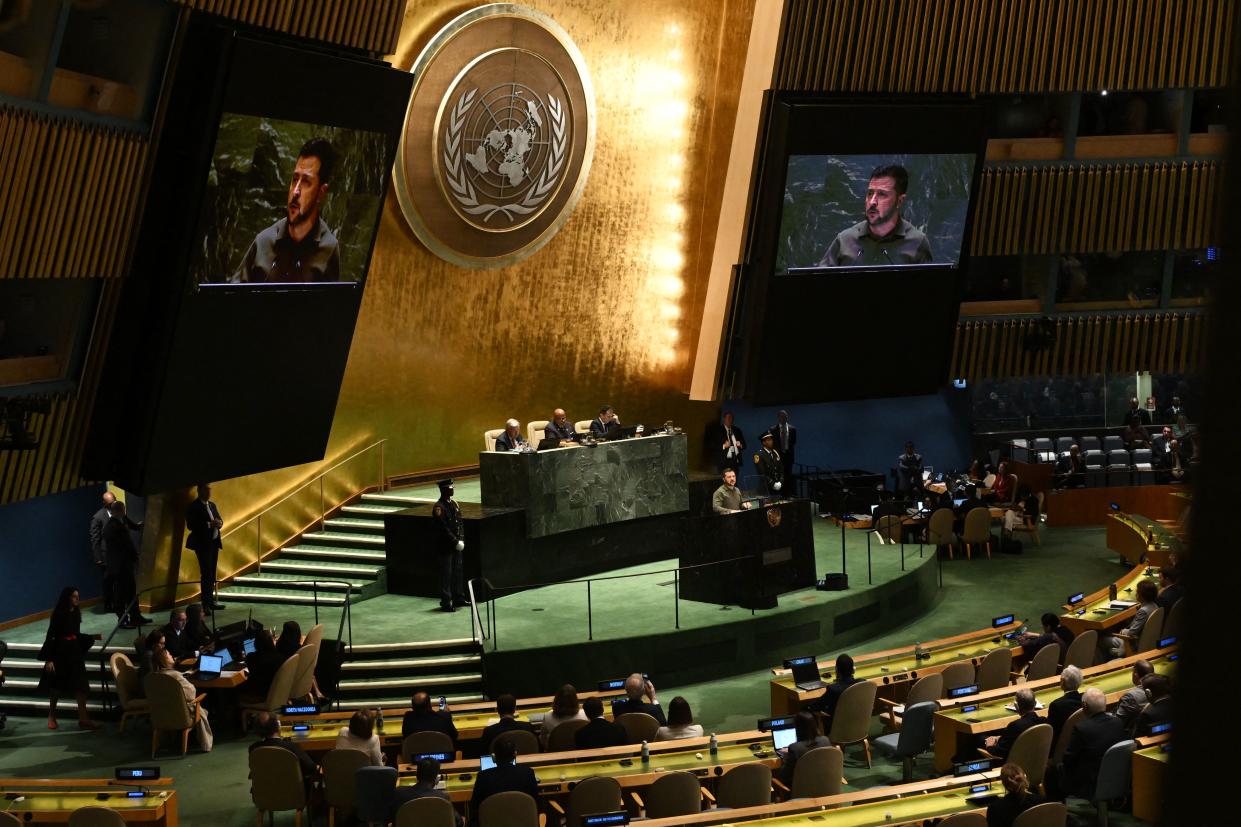 Ukrainian President Volodymyr Zelensky stands at a podium as he addresses the 78th United Nations General Assembly.