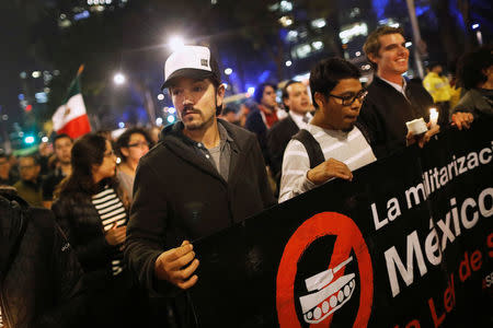Mexican actor Diego Luna marches as he protests against a new security bill, Law of Internal Security, in Mexico City, Mexico, December 13, 2017. REUTERS/Edgard Garrido