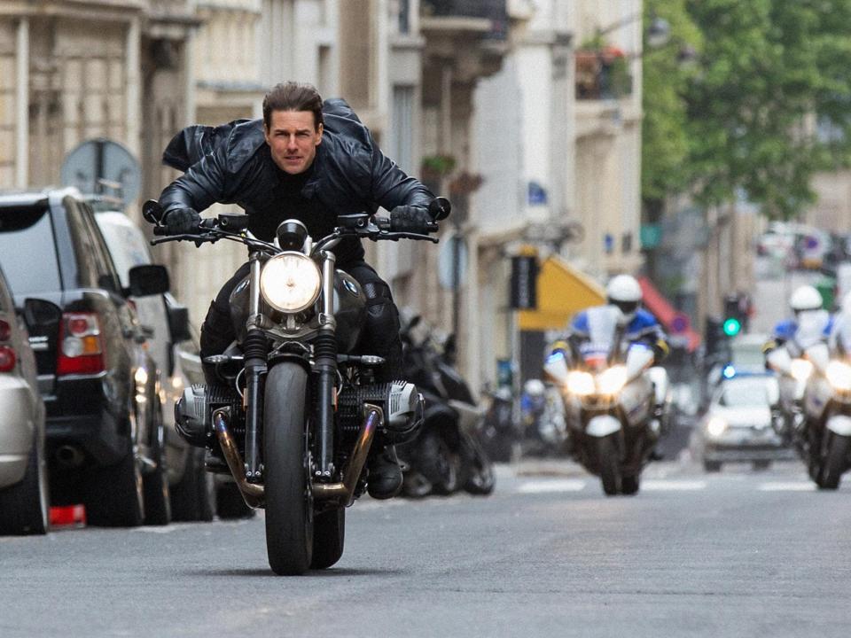 Tom Cruise on a motorbike in Paris with police chasing him in "Mission: Impossible - Fallout."