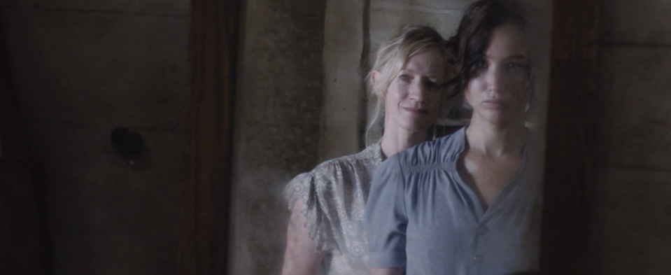 Katniss looks in the mirror with her mother