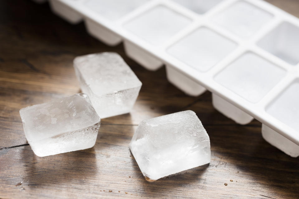ice cubes next to an ice tray