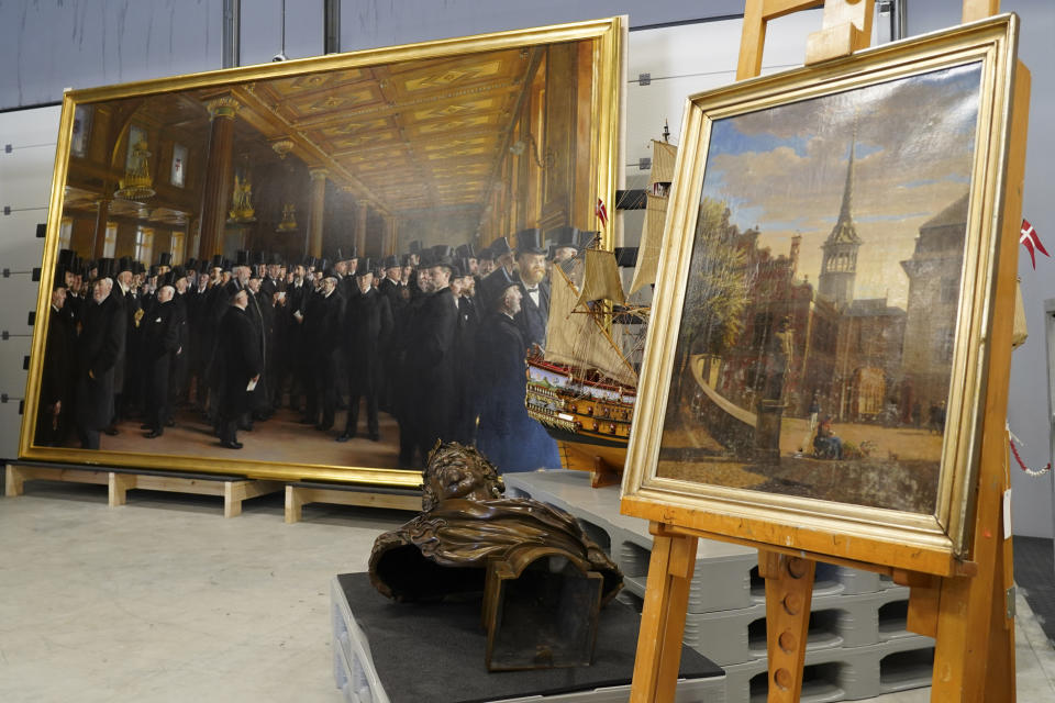 Artworks saved from Boersen during the fire are displayed at the National Museum's warehouse in Vinge, Denmark, on Tuesday, June 4, 2024. Boersen, in Copenhagen, caught fire on April 16, 2024. More than 300 art objects were saved from the burning building. (AP Photo/James Brooks)