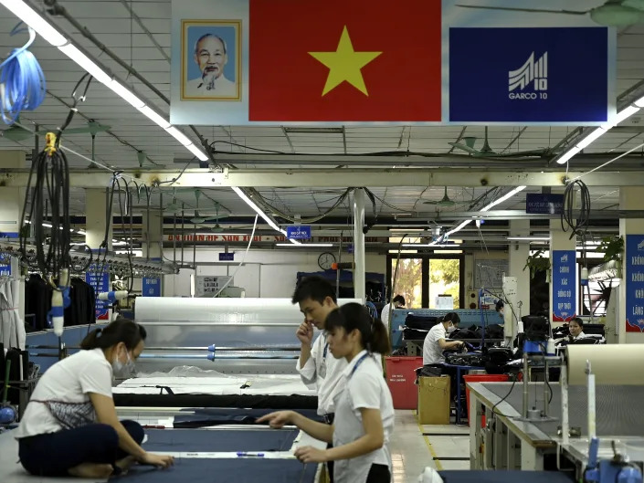 Garment factory workers working in a factory in Hanoi, Vietnam.