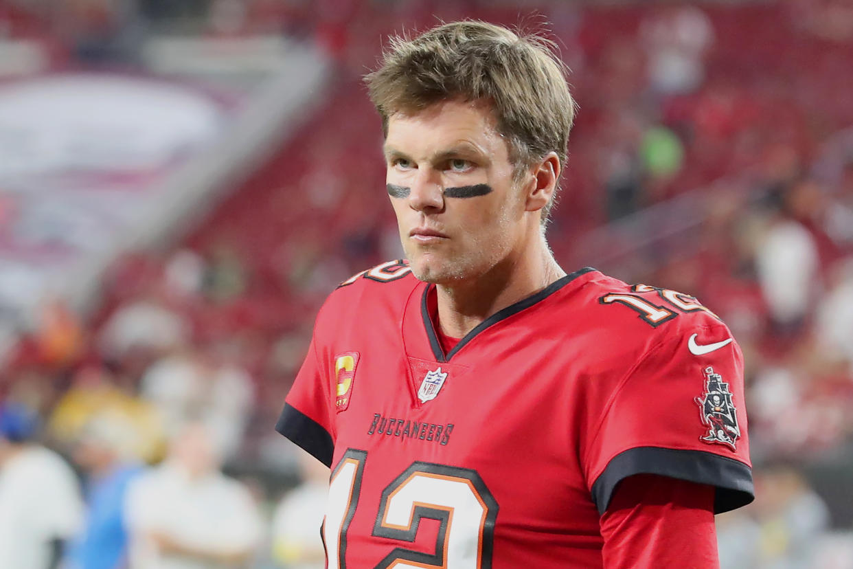 TAMPA, FL - DECEMBER 05: Tampa Bay Buccaneers Quarterback Tom Brady (12) looks over towards the sidelines before the regular season game between the New Orleans Saints and the Tampa Bay Buccaneers on December 05, 2022 at Raymond James Stadium in Tampa, Florida. (Photo by Cliff Welch/Icon Sportswire via Getty Images)