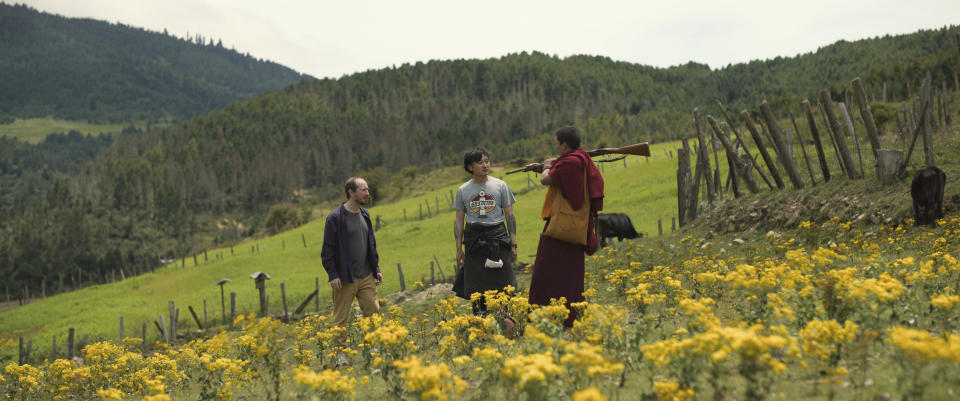 This image released by Roadside Attractions shows Harry Einhorn, from left, Tandin Sonam and Tandin Wangchuk in a scene from "The Monk and the Gun." (Roadside Attractions via AP)