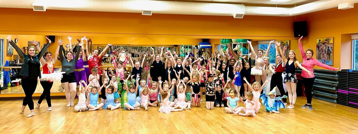 Amanda Moffett (left) and her students at Beautiful Feet Dance Studio.