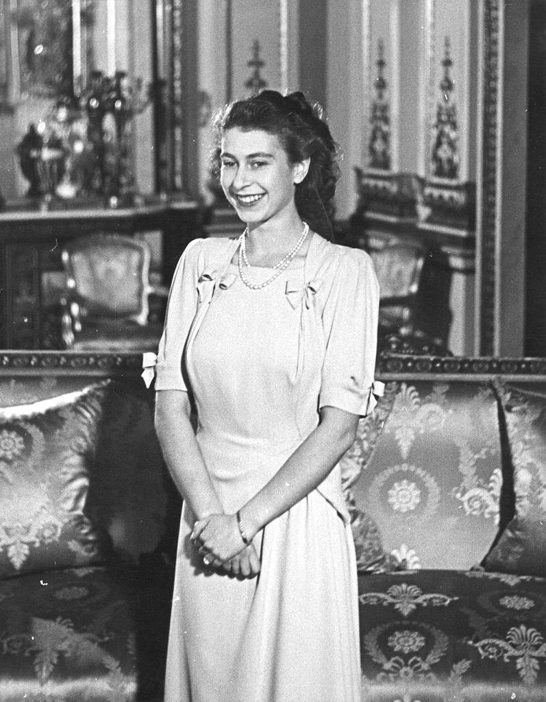 Smiling in 1947 with her hands folded in front of her