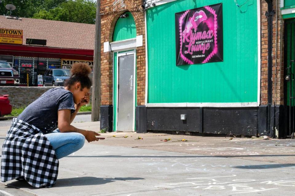Desionee Smith, mourns the loss of her cousin, Antoinette “Libby” Brenson, outside Klymax Lounge on Monday, May 22, 2023, in Kansas City. Brenson was one of the three victims who were fatally shot at Klymax Lounge early Sunday.