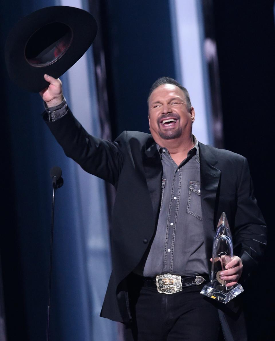 Garth Brooks celebrates his Entertainer of the Year award at the 53rd Annual CMA Awards at Bridgestone Arena Wednesday, Nov. 13, 2019 in Nashville, Tenn.

